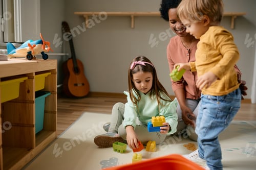 Preview: Kids Playing with Colorful Toy Blocks at Home