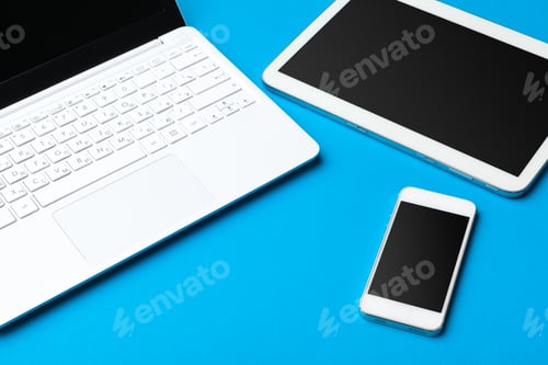 Preview: Open laptop with digital tablet on the table