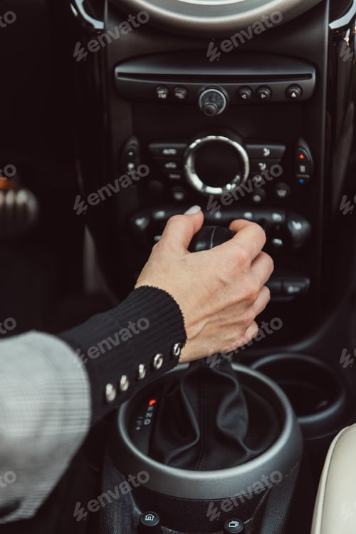Preview: cropped image of adult woman driving car