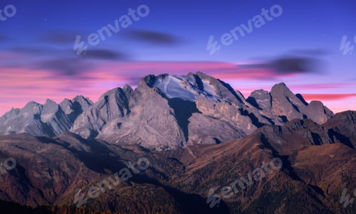 Preview: Mountain peak lighted by moonlight in autumn at night