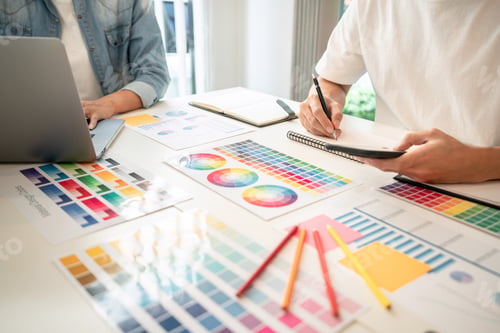 Preview: Two creative graphic designer team working on color selection an