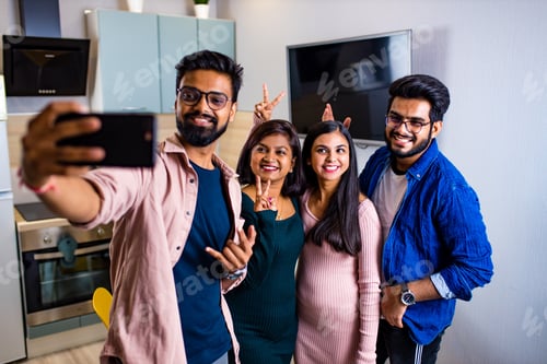 Preview: Multiracial best friends millennials at home kitchen