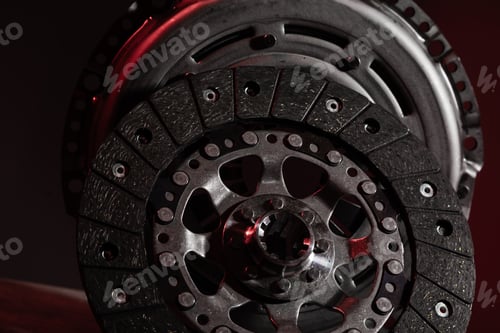 Preview: Two circle brake discs on dark red background. Disc brake rotors are metal discs that work together