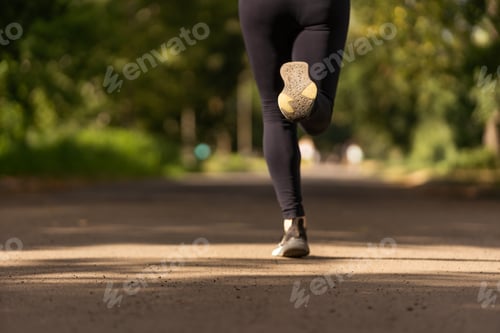 Preview: young fitness woman runner athlete running at road
