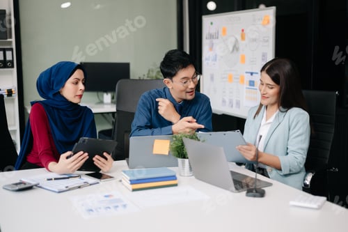 Preview: Group of Asian business meeting in planning design in creative business discussing work