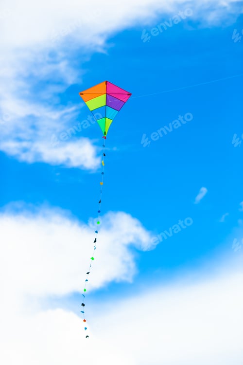 Preview: Colorful kite flying in the wind background blue sky