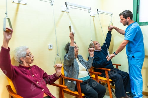 Preview: Elderly people exercising with physiotherapist in nursing home