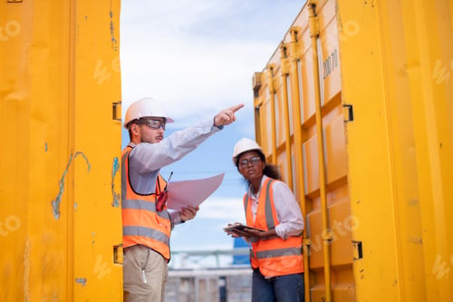 Preview: Engineers railway survey wearing safety uniform and helmet under conversation document on hand inspe
