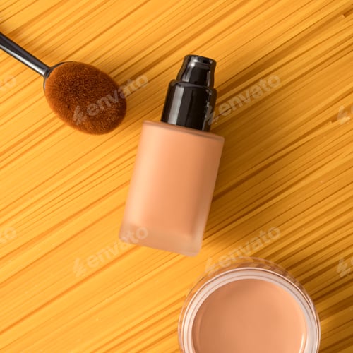 Preview: Cream and liquid foundation on yellow background with application brush