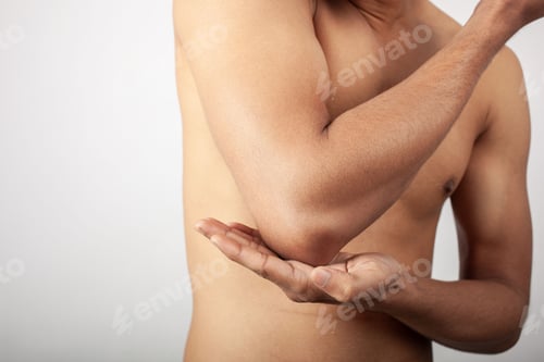 Preview: fitness man showing soreness in elbow joint injury