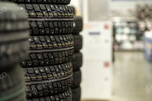 Preview: Sale of car tires for sale in the store. Many new winter tires lie