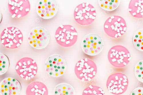 Preview: Colorful cupcakes on a white background.