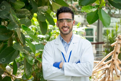 Preview: Biologist in uniform in a greenhouse