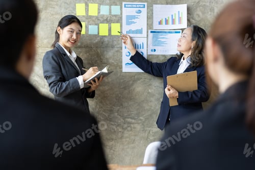 Preview: Business meeting. Senior managers talk to employees in the conference room.
