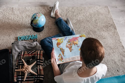 Preview: guy, at home, dreams, plane, tickets online, beach vacation, globe, map, ship and suitcase, travel