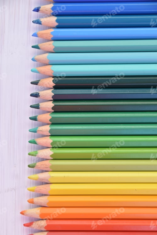Preview: lined up colouring pencils sorted by colour