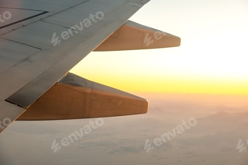 Preview: View from airplane on the aircraft white wing flying over desert landscape