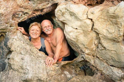 Preview: Senior happy couple having fun at the entrance of Kayangan Cave in Coron