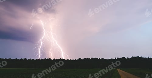 Preview: Dramatic lightning bolt at night over rural area. Agriculture fields