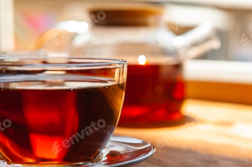 Preview: Hot cup of tea on wooden rustic table close up