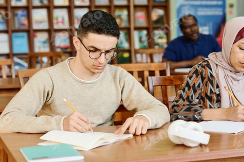 Preview: Young Man Writing Essay