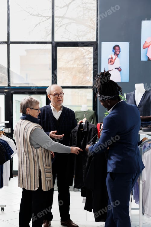 Preview: Elderly couple shopping for formal wear in showroom
