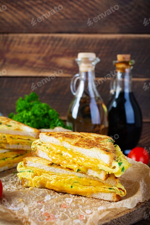 Preview: Roasted French toast with ham, egg, herbs and cheese cheddar. Delicious grilled breakfast sandwich