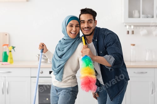 Preview: Happy arab lovers enjoying house-keeping at home