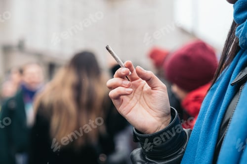 Preview: Woman smoking cigarette near people in public, passive smoking