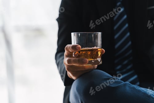 Preview: drunk asian man hold whisky glass addicted alcohol need therapy.