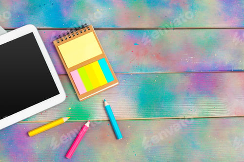 Preview: Modern blank digital tablet with papers and pen on a wooden desk. Top view. High quality