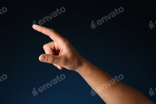 Preview: Man touching something on blue background, closeup