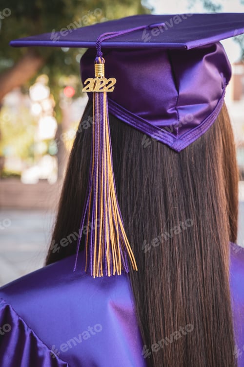 Preview: Girl in a purple graduation gown from behind