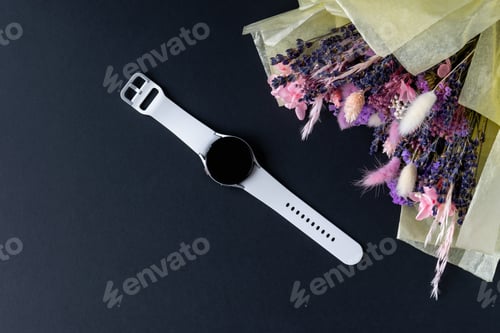 Preview: Minsk, Belarus - December 2021: Market novelty smart watch samsung galaxy watch 4 with a white brac