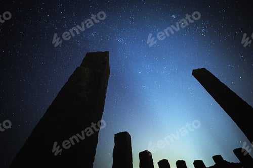 Preview: Stunning low angle shot of the nighttime sky with stone structures in frame