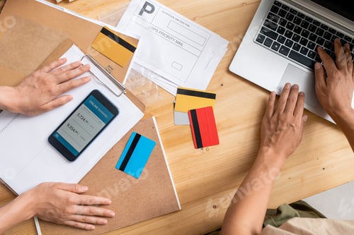 Preview: View of young female managers hands over workplace during checking information