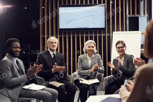 Preview: Excited business people applauding sales coach