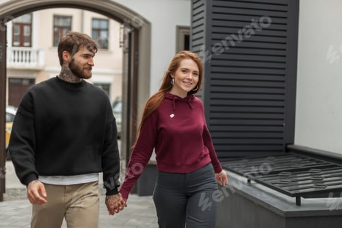 Preview: Beautiful fashionable urban couple in stylish street clothes