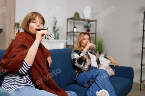 Preview: Mother and daughter drinking wine together