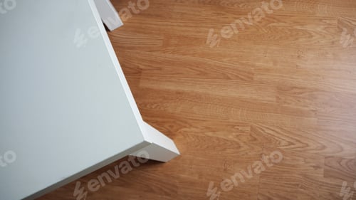 Preview: White desk top angle view with wood background.