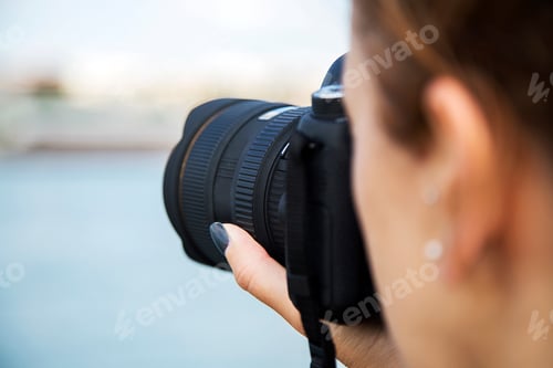 Preview: Young woman with camera
