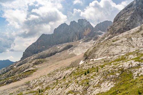 Preview: Idyllic landscape with green moss covered mountain rock