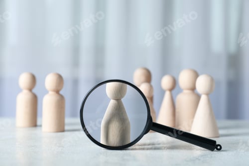 Preview: Magnifying glass and wooden figures on light background