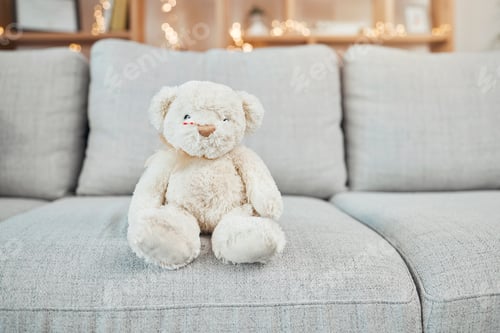 Preview: Teddy bear, child toy and baby toys on a living room sofa for a christmas or birthday present. Soft