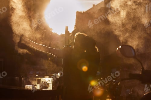 Preview: Couple standing on street in sunset.