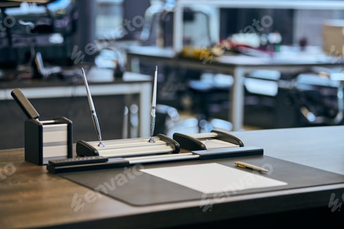 Preview: Modern office work place in large corporation. Comfortable work table with stationery