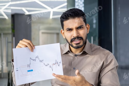 Preview: Frustrated businessman analyzing fluctuating stock market graph