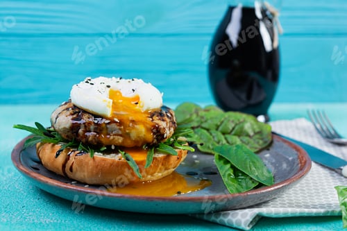 Preview: Delicious breakfast with poached eggs, bun and chicken cutlet. Eggs Benedict