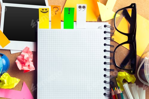 Preview: Desk of an artist with lots of stationery objects