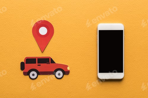 Preview: top view of paper cut cars, location mark near smartphone with blank screen on orange background